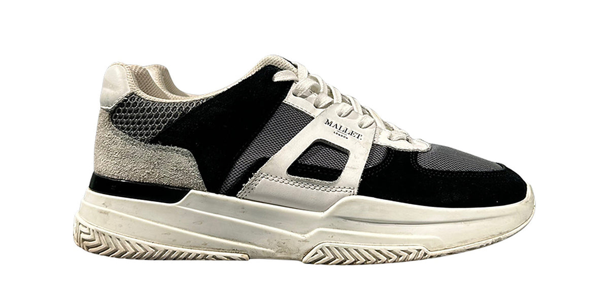 Suede sneaker before treatment, greyed suede and a dirty midsole